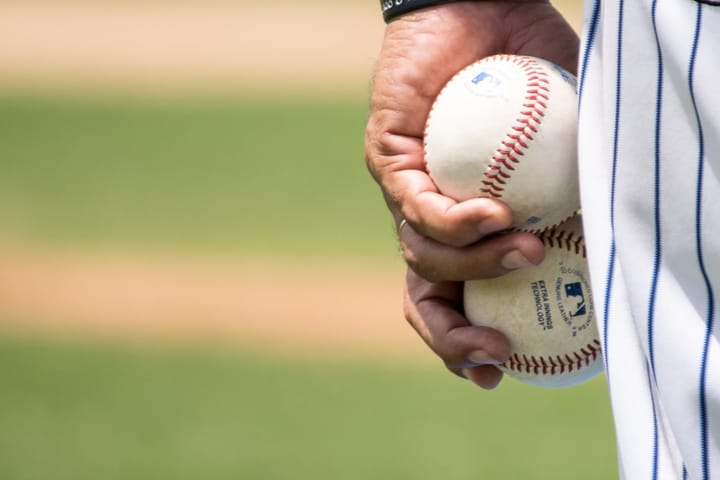 baseball player with baseballs